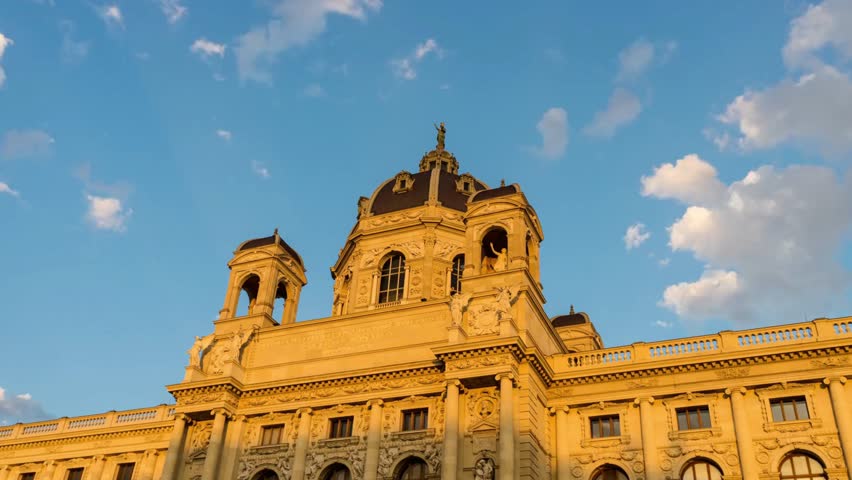 The kunsthistorisches museum in vienna, austria, under a blue sky with clouds