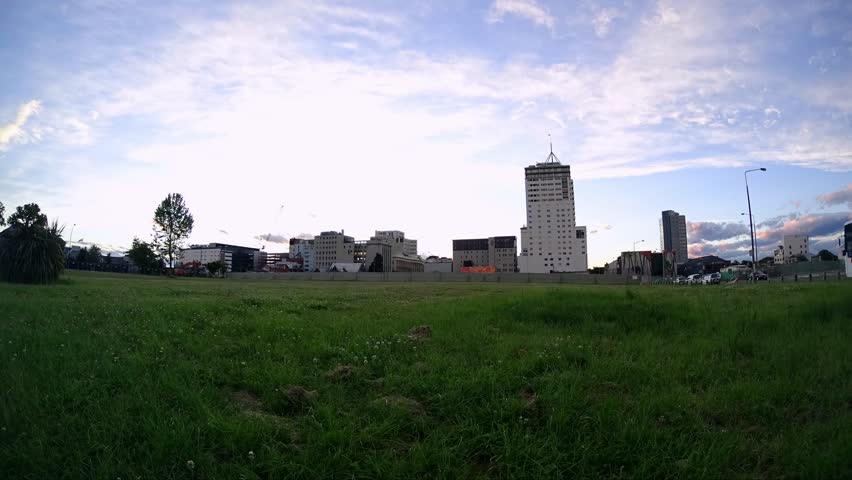 Dramatic time-lapse of Christchurch cityscape with shifting clouds and light, filmed in New Zealand on a summer day in January 2017.