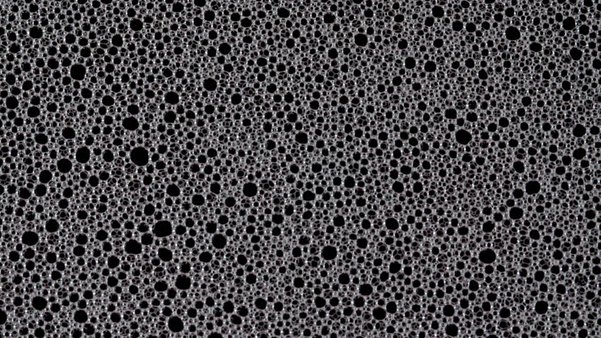 Texture of white soap foam with bubbles abstract background. Soap sud macro structure. Bathtup Soap Foam. Natural White Shampoo Bubbles Motion.