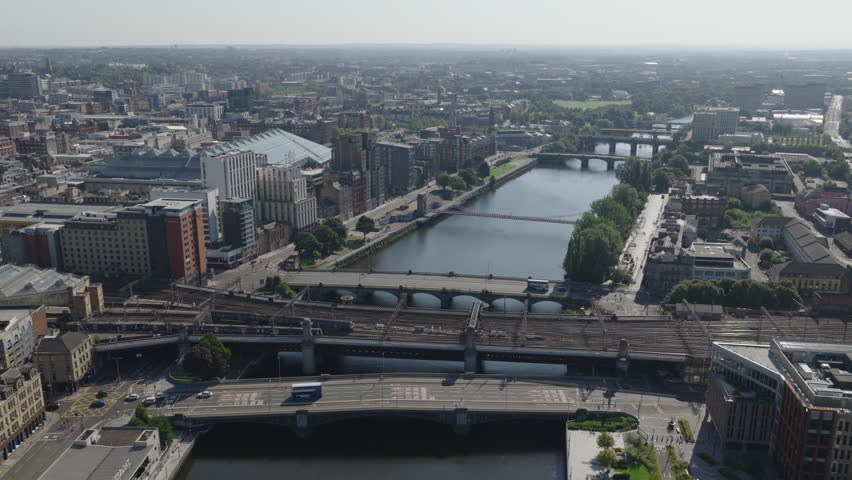 Establishing aerial view of Glasgow, city in Scotland, United Kingdom on bright, sunny day.