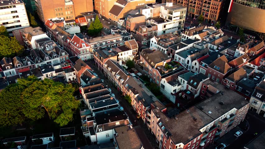 Aerial drone flight over Utrecht, Netherlands. Scenic cityscape with historic architecture, canals, and urban landscape captured from above.