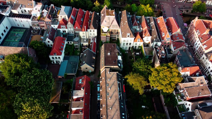 Aerial drone flight over Utrecht, Netherlands. Scenic cityscape with historic architecture, canals, and urban landscape captured from above.