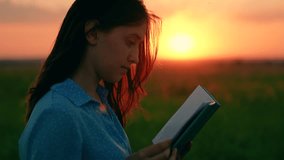 Young woman reads book in autumn park in rays of sunset. Prayer in nature. Student reads textbook in nature in spring. Man reading book outdoors. Studying, education. Beautiful woman praying at sunset - Powered by Shutterstock - Get 15% off with code: PIKWIZARD15