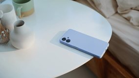 Lady hand taking cellphone from bedside table at early wake up in modern bedroom closeup. Unrecognizable woman checking time turning off phone alarm at light apartment. Unknown girl looking smartphone - Powered by Shutterstock - Get 15% off with code: PIKWIZARD15