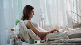 Lady closing laptop in bed finish email reading early morning. Calm beautiful woman lying comfortable white bedding with computer on knees. Relaxed brunette freelancer working home in cozy bedroom. - Powered by Shutterstock - Get 15% off with code: PIKWIZARD15