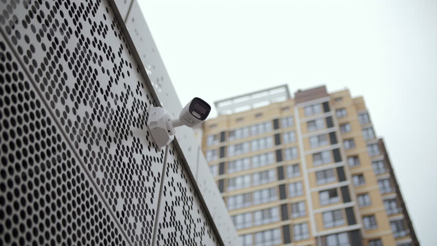 Surveillance camera on modern building facade