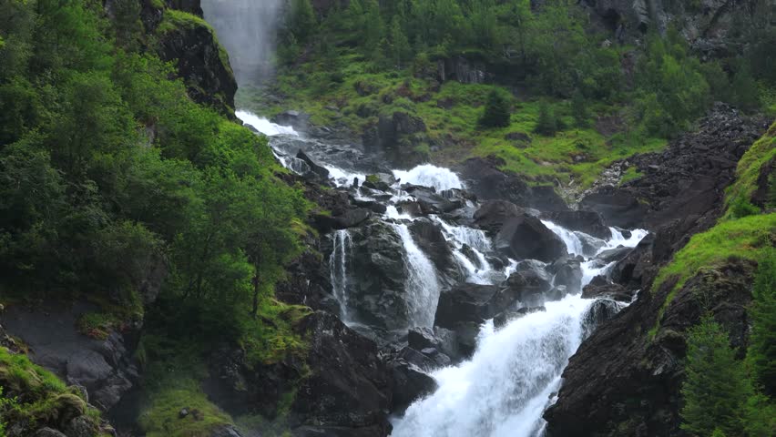 The Låtefossen in the green mountain running down, Norway, travel experience