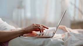 Woman hands typing laptop at white cozy bedding closeup. Relaxed brunette freelancer working in bed early morning drinking coffee. Calm lady browsing social media computer awakening in comfortable bed - Powered by Shutterstock - Get 15% off with code: PIKWIZARD15