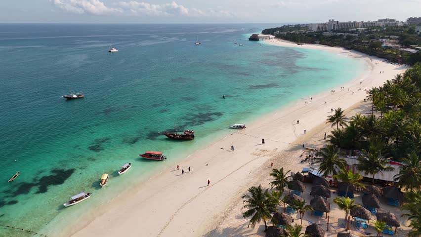Aerial shot of boats on turquoise waters in Zanzibar, Tanzania