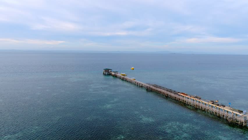 Experience paradise at this exquisite resort in Cebu, Philippines, surrounded by crystal clear waters and vibrant coral reefs. Dive into the beauty of Nalusuan Island.