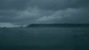 Slow motion raindrops ripple across stormy ocean surface under dark grey skies - Powered by Shutterstock - Get 15% off with code: PIKWIZARD15