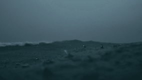 Close shallow focus captures rainfall dancing on storm darkened ocean surface - Powered by Shutterstock - Get 15% off with code: PIKWIZARD15