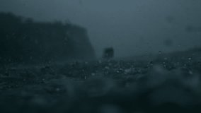 Dramatic storm seascape with rainfall falling steadily on rough grey waters - Powered by Shutterstock - Get 15% off with code: PIKWIZARD15