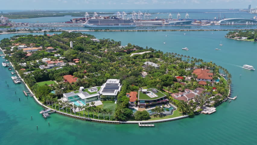 Star Island in Miami beach, Florida. Residential buildings in luxury Star island surrounded by sea. Waterfront residential area on Star island, Miami. Florida landscape view