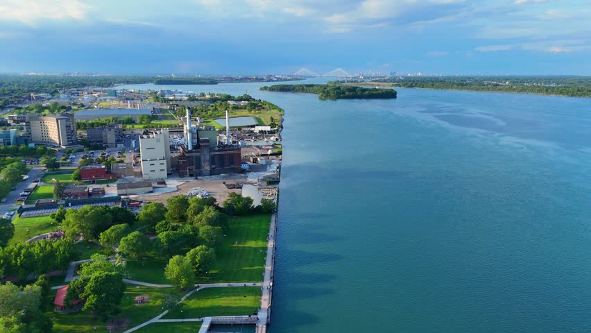 Wyandotte Power Plant with Bisho Park on Detroit River with city skyline, MI, USA