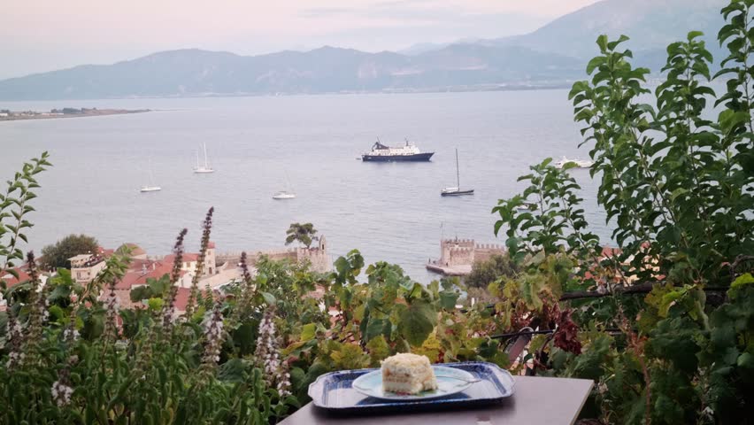 Mille-feuille Dessert with Scenic Sea View and Boats in Nafpaktos, Greece