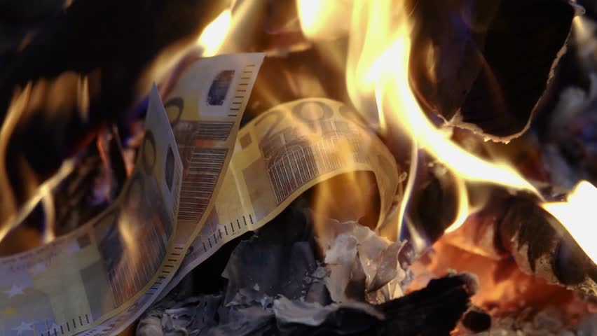 Burning euro banknotes in fire