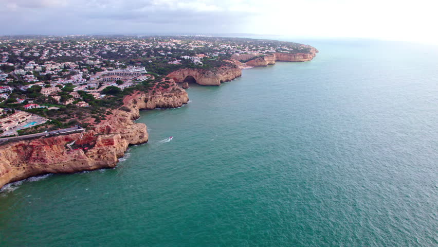Aerial footage of the costline of Lagoa, near Carvoeiro, in Algarve, Portugal.
