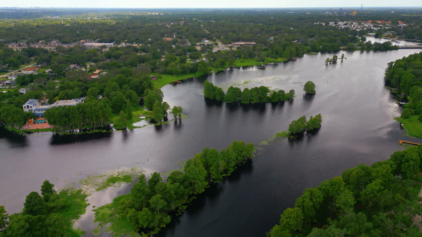 Hillsborough River With a Nature Park and Neighborhood In Florida, USA. - aerial shot slowly orbiting