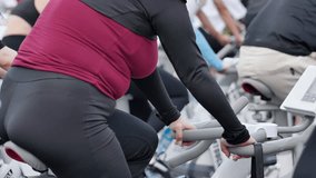 The buttocks of a fat woman burning fat on an exercise bike during an outdoor sports day. - Powered by Shutterstock - Get 15% off with code: PIKWIZARD15