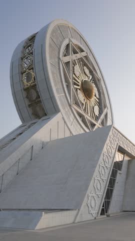 White marble Ferris Wheel landmark in Ashgabat, Turkmenistan, vertical footage