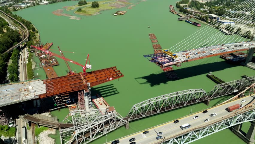 The Pattullo Bridge Replacement is Currently Being Built Over the Fraser River in Vancouver, British Columbia, Canada - Aerial Drone Shot