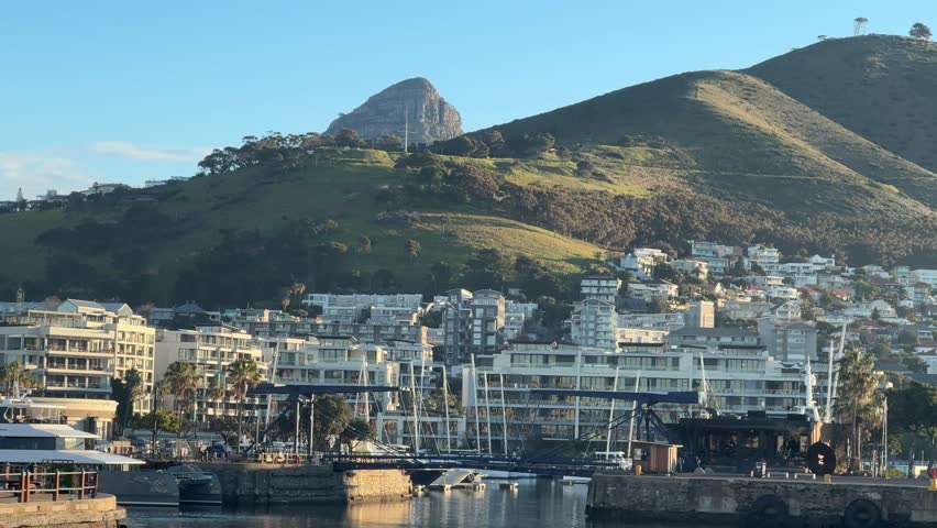 View of Lions Head peaking out from behind Signal Hill in Cape Town, South Africa.