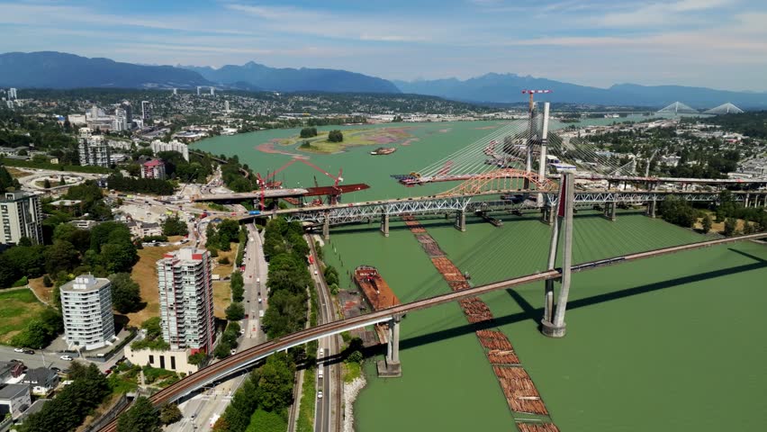The Pattullo Bridge Replacement is Progressing Across the Fraser River in New Westminster, Vancouver, British Columbia, Canada - Orbit Drone Shot