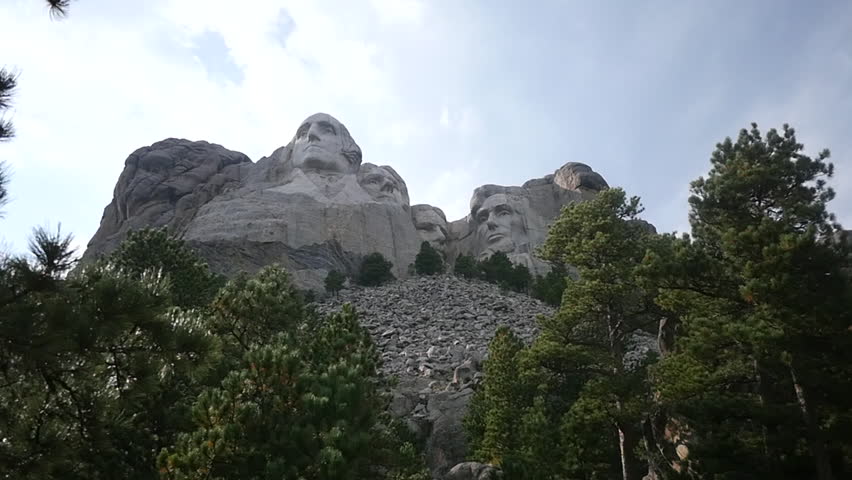 View looking upward towards Mount Rushmore on a sunny day