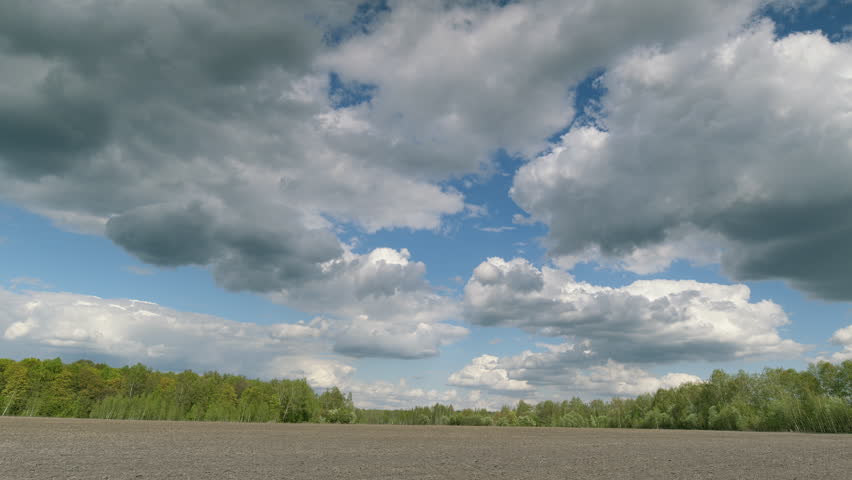 A Beautiful Skyscape Over a Tranquil Landscape Rich with Lush Foliage and Serenity