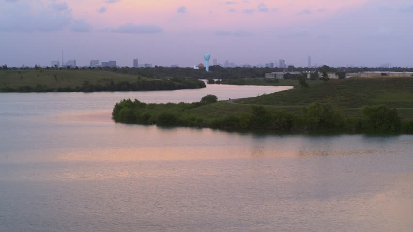 Establishing Aerial Shot of Bayou in Houston with Downtown Skyline Behind