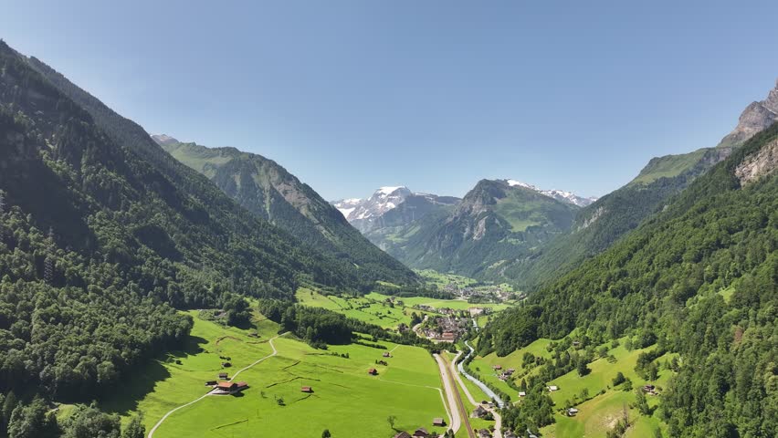 Magical panoramic aerial view of Betschwanden valley with Tödi mountain in Switzerland.