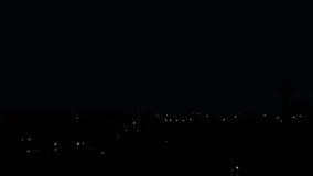 Dramatic Lightning Strike on a City Tower. Purple Sky at Night. City Nightlife Interrupted. Lightning Hits a Transformer and Causes a Power Flash. - Powered by Shutterstock - Get 15% off with code: PIKWIZARD15