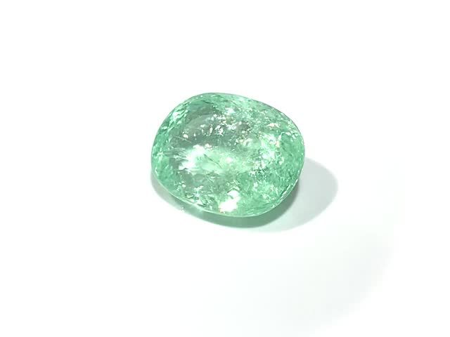 Beautiful Bluish Green Paraiba Tourmaline Rotating on a White Background