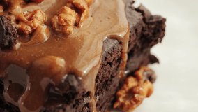 Caramel sauce on chocolate hazelnut brownie close up.  - Powered by Shutterstock - Get 15% off with code: PIKWIZARD15