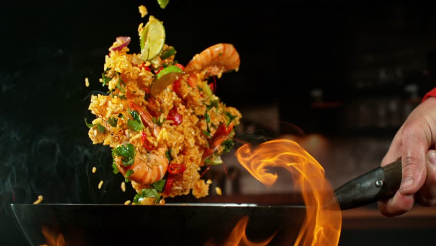 Super Slow Motion of Flying Paella Ingredients . Filmed on High Speed Cinema Camera