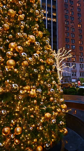 New York, USA, 17 December 2024: NY streets glow with holiday decor. Holiday lights and a decorated tree illuminate New York streets, crafting a magical festive atmosphere.