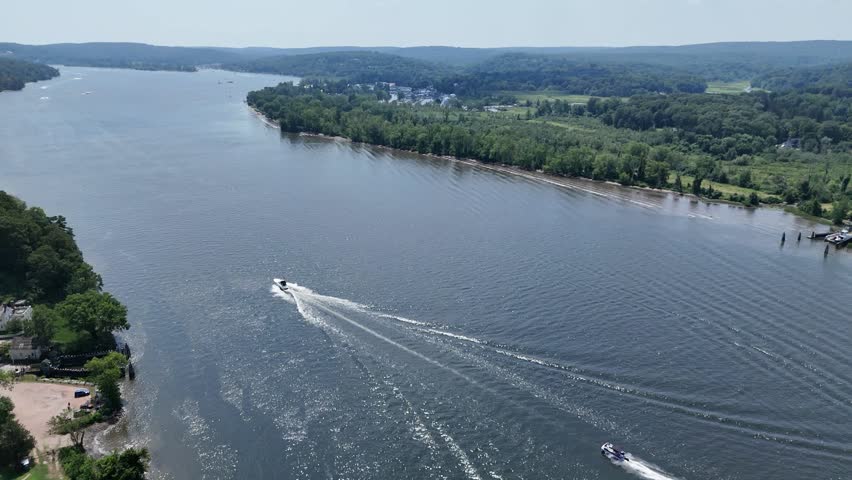 Aerial view of the Connecticut River in East Haddam, CT. Serene waterway winding through lush forest and hills. Scenic New England nature perfect for travel and landscape themes.