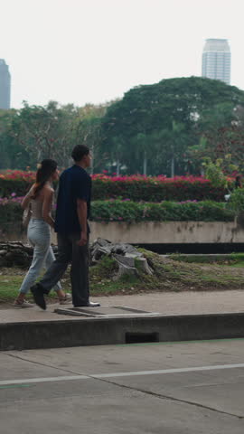 Tourists enjoying a walk in bangkok, thailand near a busy road