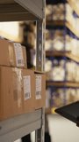 Vertical Video African american woman using scanner to register barcodes tags in inventory, solving logistics operations in industrial warehouse. Worker checking shipping labels near storage racks - Powered by Shutterstock - Get 15% off with code: PIKWIZARD15