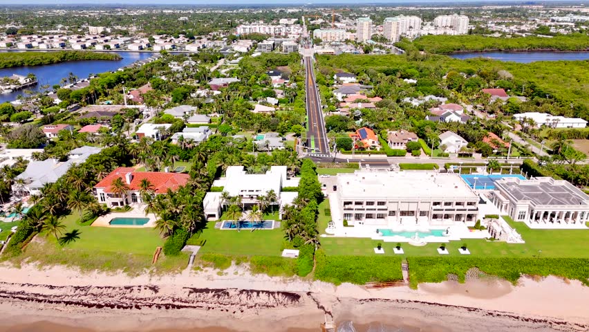 Aerial stock video Boynton Beach Florida showcasing luxury mansions on the beach