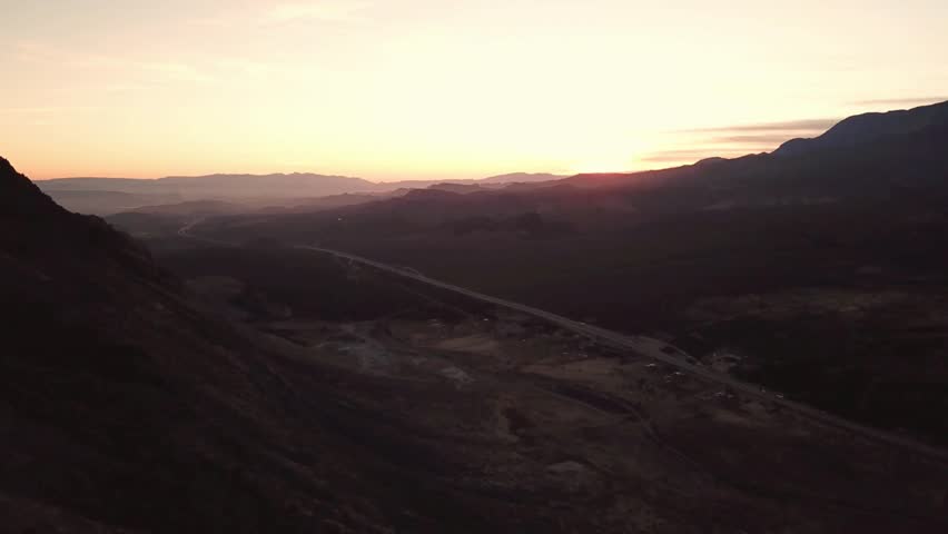Scenic mountain landscape with road and valley at sunset with a beautiful sky