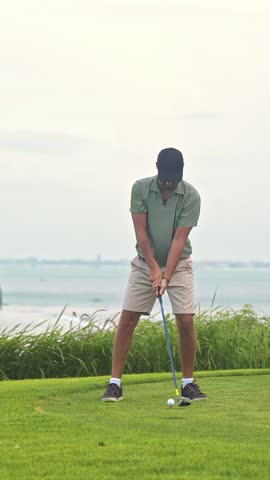 Adult Sports Man Playing on Green Golf Course and Hitting Ball by Club. Athletic Male Person is Real Winner at Championship Cup. Champion Kicking Golfball with Accuracy and Scoring with Birdie Stroke