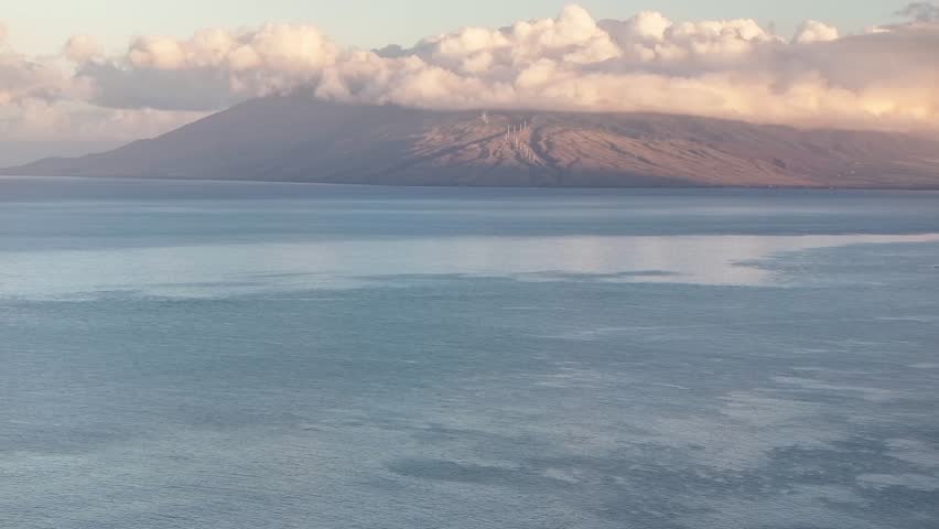 Explore Breathtaking Aerial Views of Maui Hawaii Showcasing Lush Landscapes, Mountains, and Serene Ocean Waters at Sunrise - 4K Drone