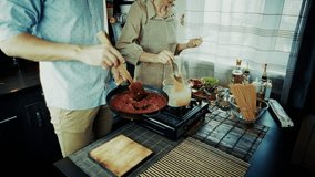 Happy Couple Cooking Dinner Together. Man, Woman Preparing Delicious Italian Meal Of Pasta Sauce. Husband, Wife Teamwork In Kitchen. Preparing Healthy Home-Cooked Meal. Culinary Hobby Cooking Together - Powered by Shutterstock - Get 15% off with code: PIKWIZARD15
