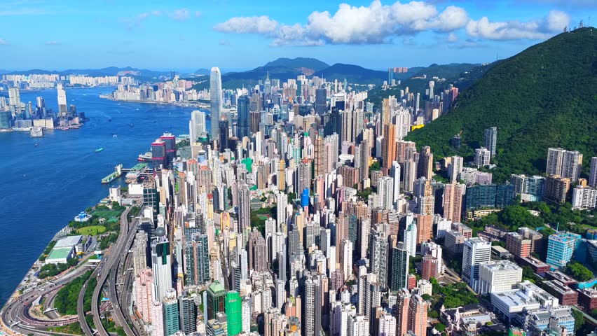 Skyview of independent single story high rise building in the slopes of Hong Kong Central Sheung Wan The Peak Sai Ying Pun and Kennedy Town mid area areas overlooking breathtaking Victoria Harbour