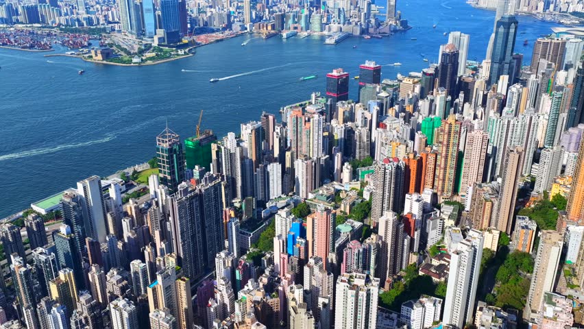 Skyview of independent single story high rise building in the slopes of Hong Kong Central Sheung Wan The Peak Sai Ying Pun and Kennedy Town mid area areas overlooking breathtaking Victoria Harbour