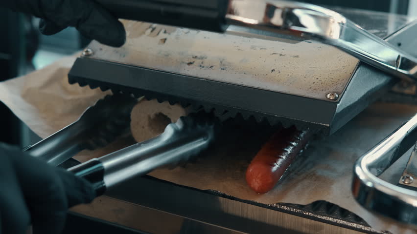 With precision and skill, cook up delicious hot dogs and perfectly toasted buns using a professionalgrade grill setup