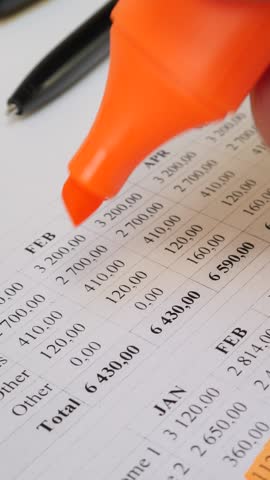 Personal savings and budget tracking process. Organized financial records with highlighted expenses. Cost-effective strategies for debt reduction, wealth building, and financial independence