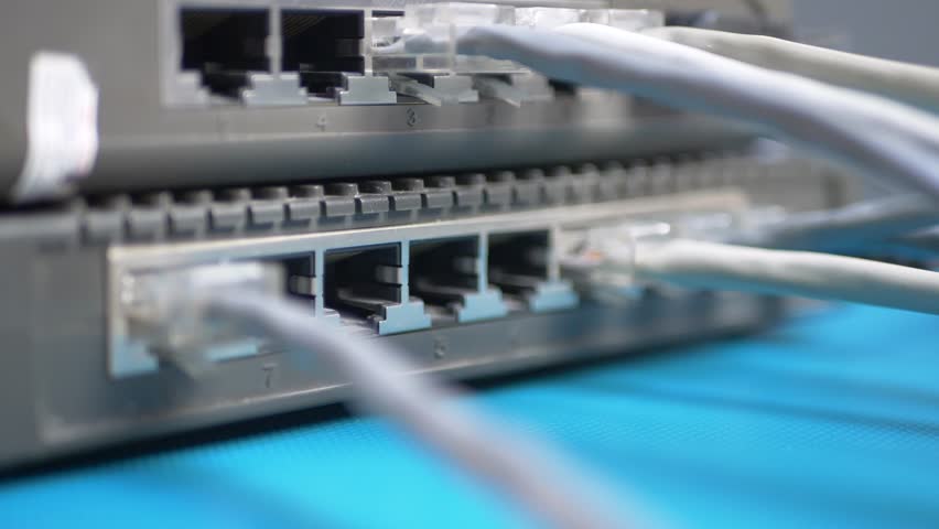 Internet router with multiple Ethernet cables forms active LAN network. Server room. Data technology support continuous telecommunication and communication. Digital data exchange, hardware performance - Powered by Shutterstock - Get 15% off with code: PIKWIZARD15